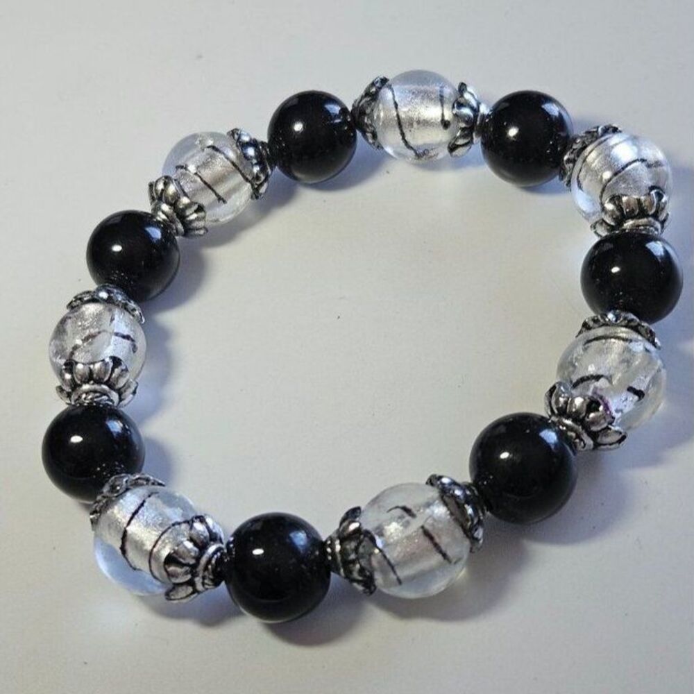 Silver tone, black and clear bracelet 7.25"